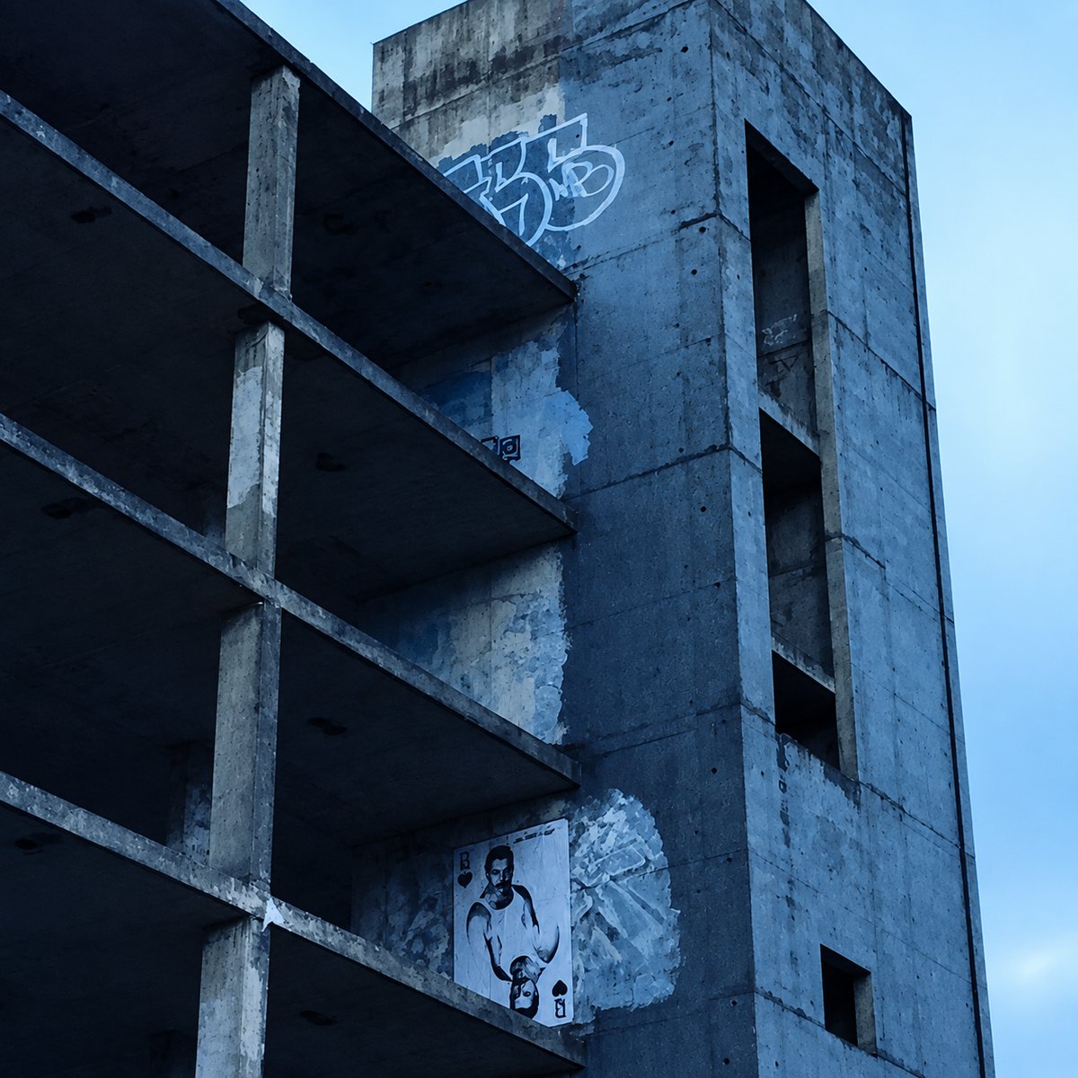 Love is Lost — Freddie Mercury poster on concrete building